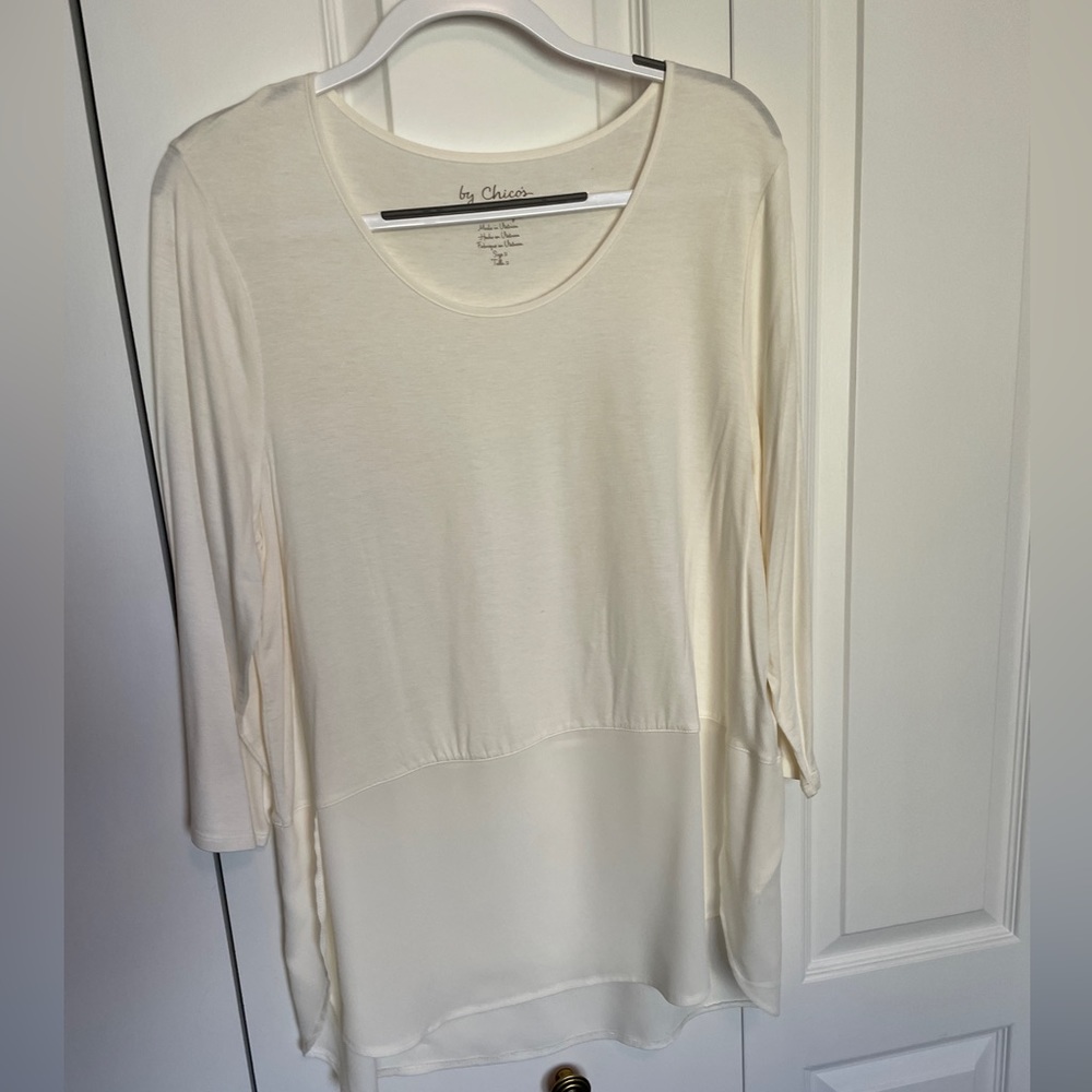 Cream top with sheer bottom.